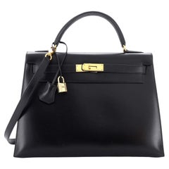 Sac à main Hermès Kelly en cuir de veau avec finitions dorées, taille 32