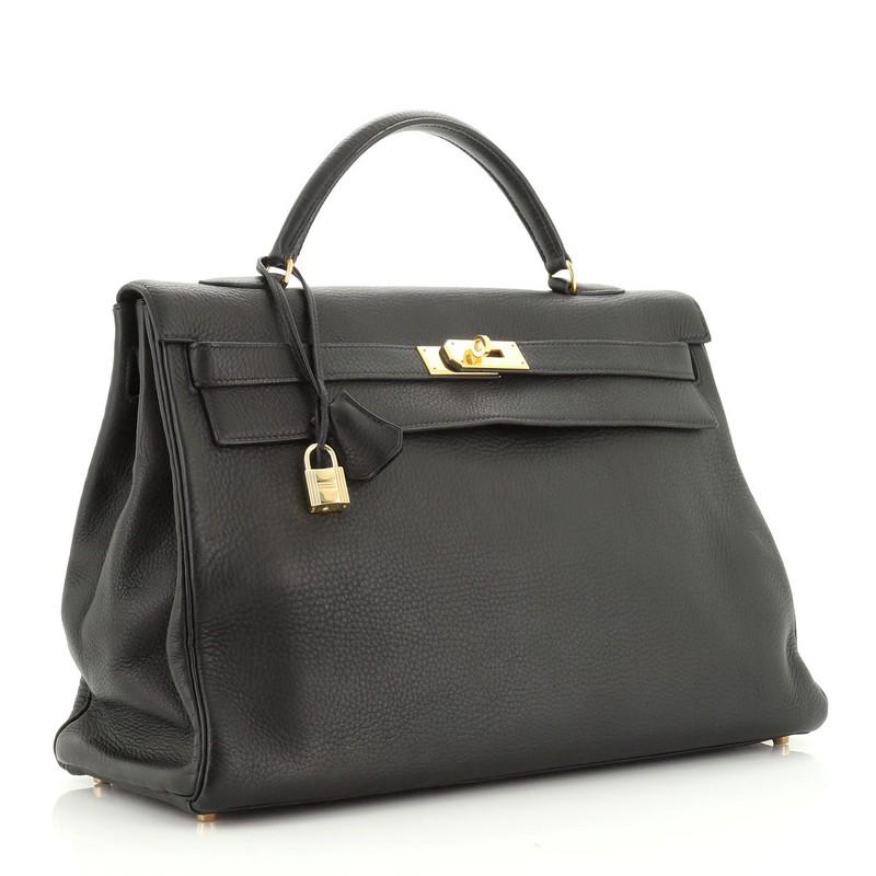 Condition: Fair. Heavy loss of shape on exterior, wear on base corners, cracking on handle wax edges. Moderate bubbling underneath flap, scuffs and discoloration in interior, scratches on hardware.
Accessories: Keys, Lock, Clochette
Measurements: