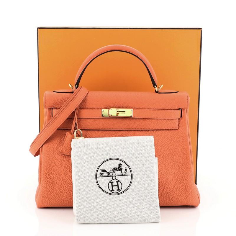 This Hermes Kelly Handbag Orange Poppy Clemence with Gold Hardware 32, crafted in Orange Poppy orange Clemence leather, features a single rolled top handle, protective base studs, and gold hardware. Its turn-lock closure opens to an Orange Poppy