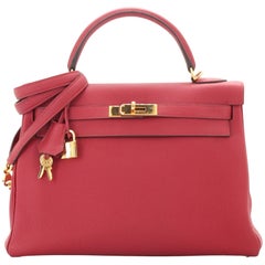 Sac à main Hermès Kelly rouge grenat Togo avec finitions métalliques dorées 32