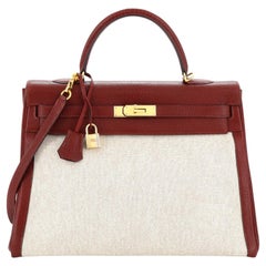 Sac à main Hermès Kelly en toile et chèvre de Coromandel rouge avec finitions métalliques dorées 35