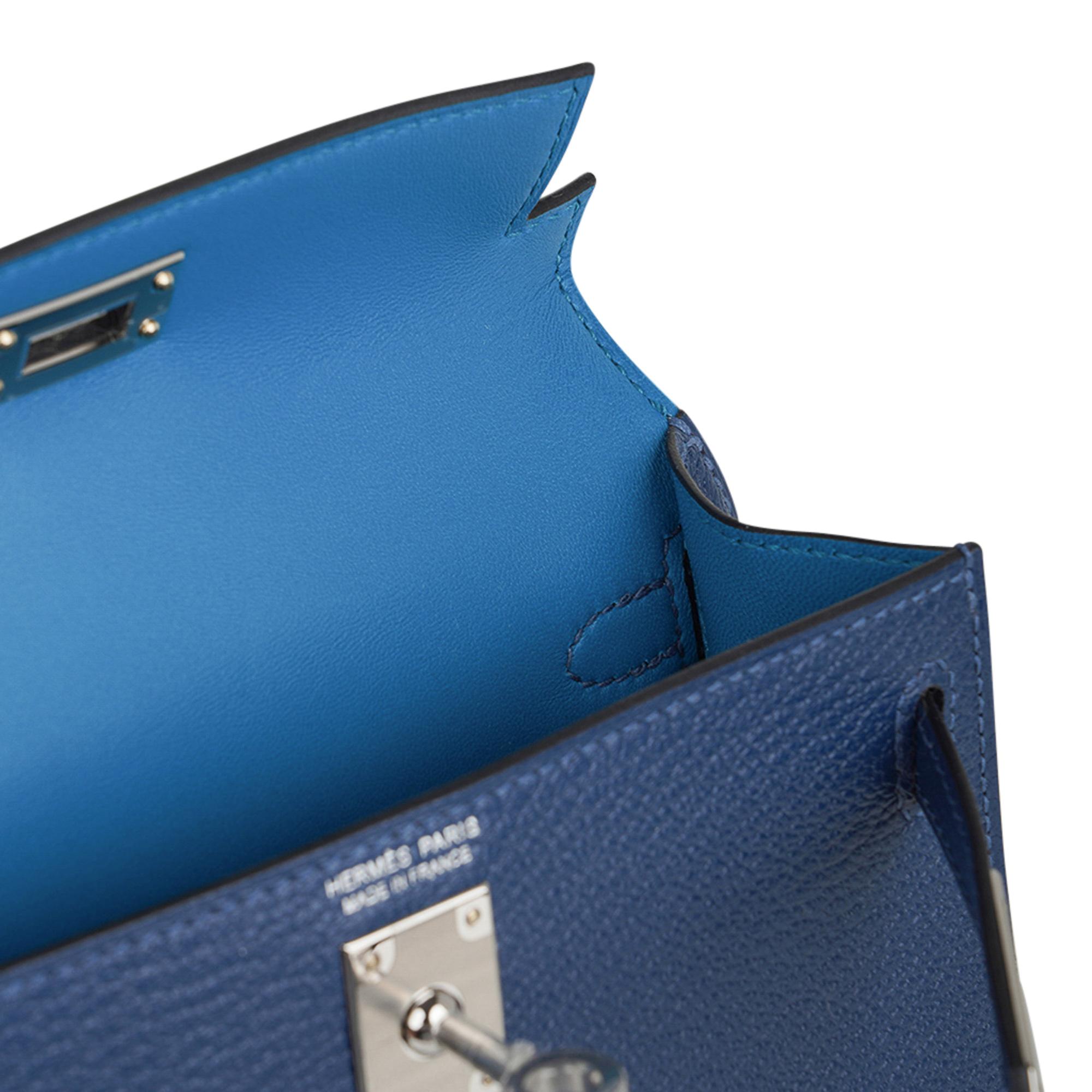 Mightychic offers an Hermes Kelly Verso 20 Mini Sellier bag featured in Deep Blue and Blue Izmir  interior..
Espom leather accentuated with Palladium hardware.
Comes with signature Hermes box, shoulder strap, and sleeper.
Please see the extensive