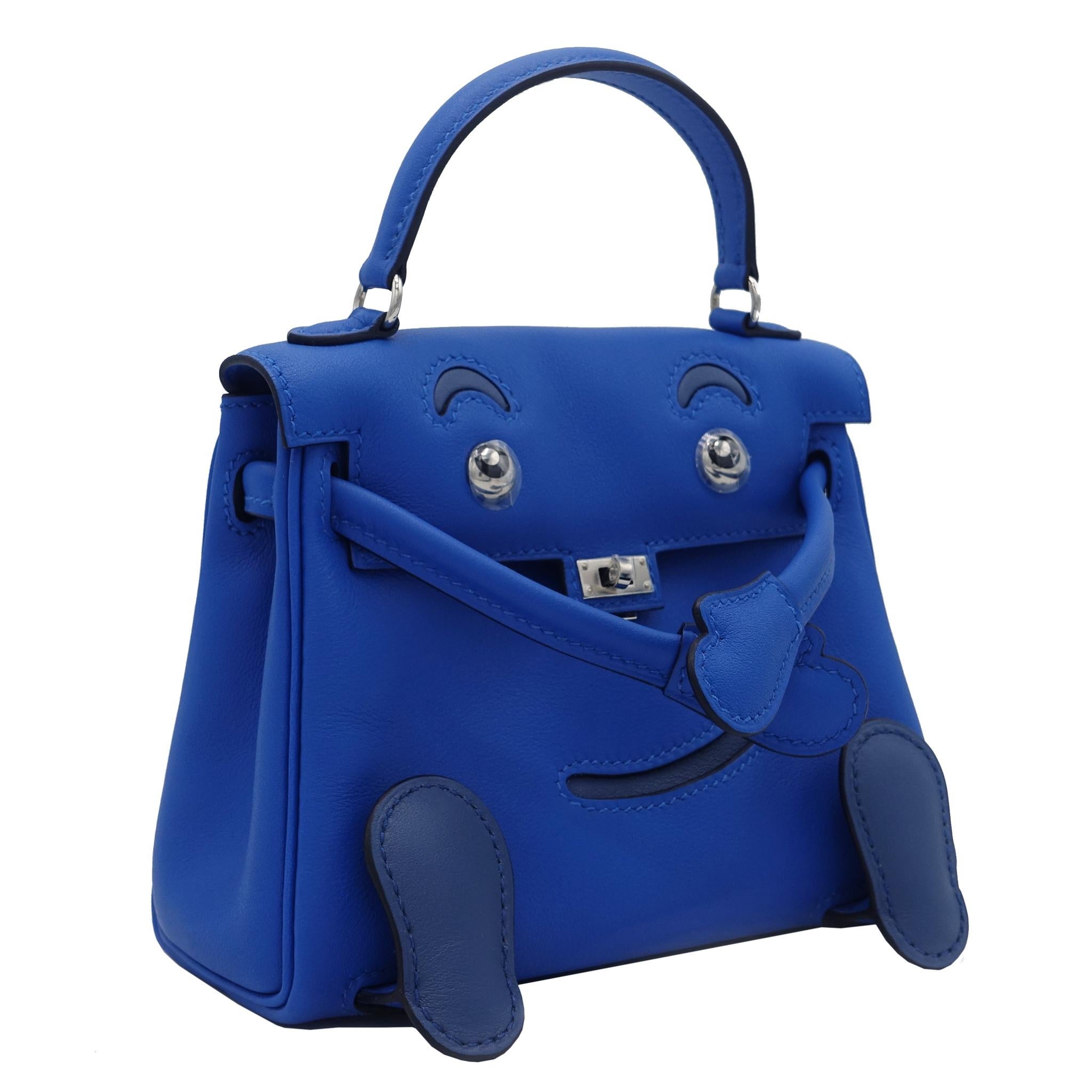 Brand: Hermès 
Style: Kelly Idole 
Size: 15cm
Color: Blue Zellige & Blue Agate
Leather: Swift
Hardware: Palladium
Stamp: 2019 D

Condition: Pristine, never carried: The item has never been carried and is in pristine condition complete with all
