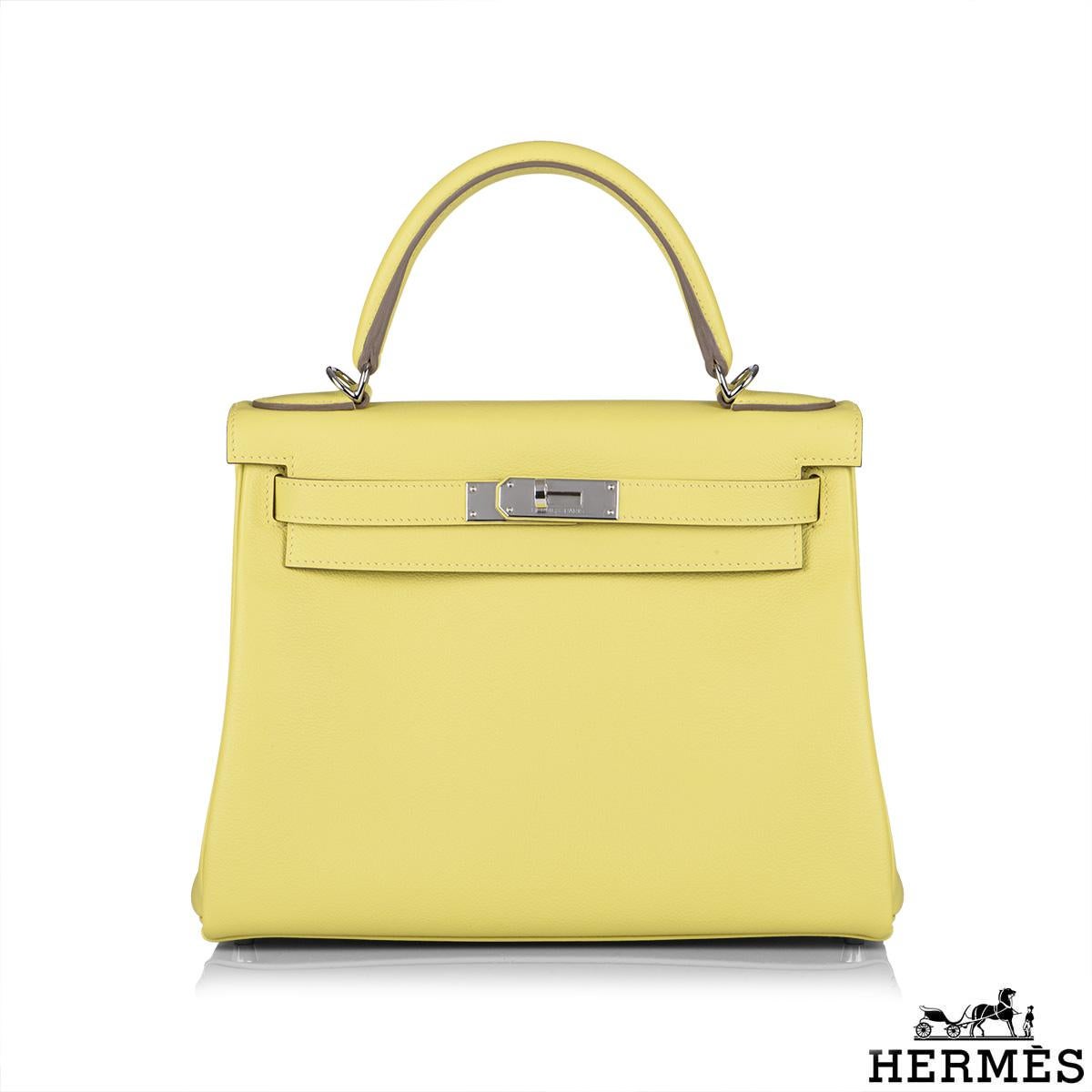 An exquisite Hermès Kelly II Lime Retourne 28cm Handbag. The vivid lime evercolour calfskin leather bag is detailed with palladium hardware. The exterior of this Kelly features a Retourne style in lime calfskin leather. It has a front toggle