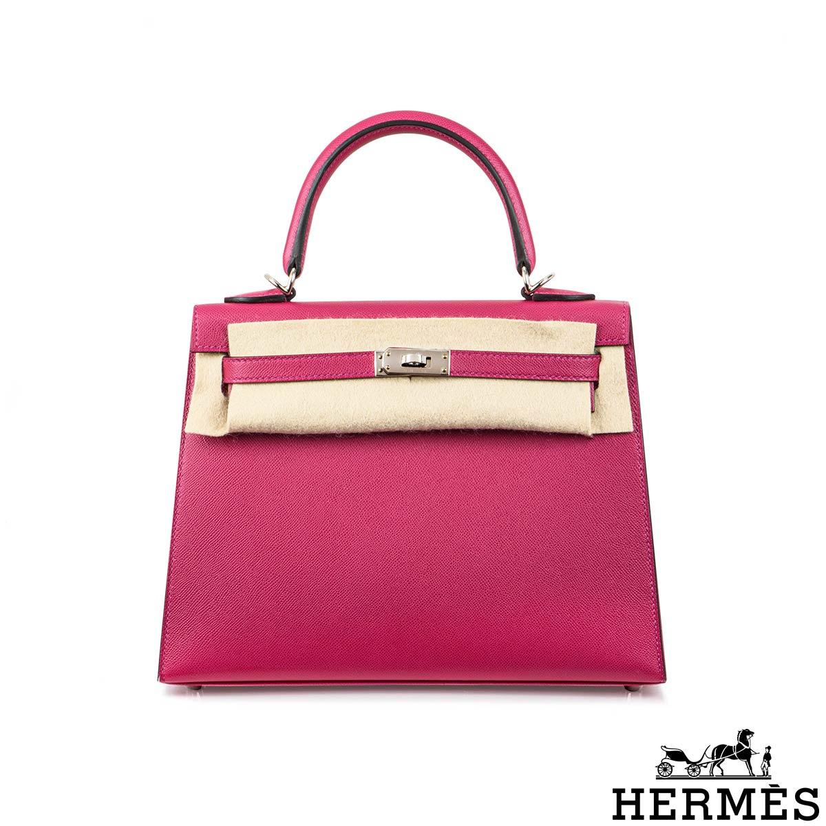 A spectacular Hermès 25cm Kelly Verso bag. The exterior of this Kelly Verso features a Sellier style in Rose Pourpre Veau Madame leather. The Rose Pourpre Madame leather is complemented with palladium hardware and tonal stitchings. It features a