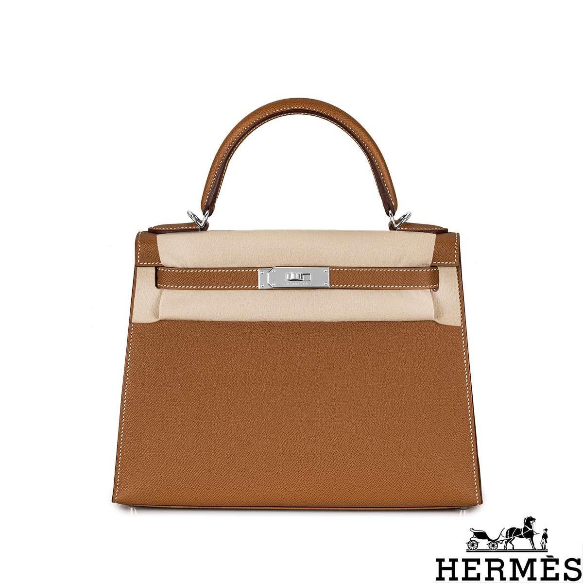 A classic Hermès Kelly II Sellier 28cm handbag. The exterior of this Kelly features the Sellier style in Gold Veau Epsom leather and is complemented by palladium hardware and white stitchings. It has a front toggle closure with two straps, a single