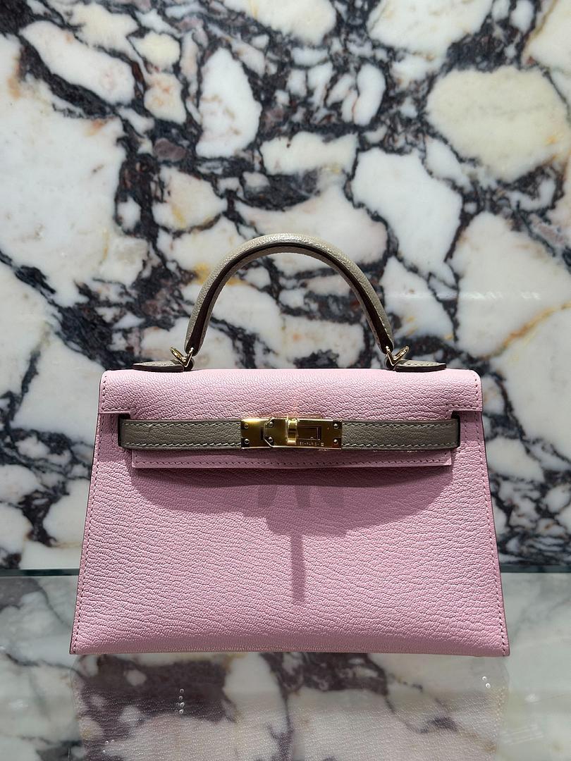 Jewels Aficionado offers an Hermes Kelly II Sellier Mini 20 HSS Rose Sakura and Gris Tourterelle Chevre GHW

This special order Mini Kelly 20 is the perfect mix of soft femininity and timeless elegance. The HSS combination of Rose Sakura and Gris