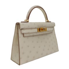 Hermès Kelly II Sellier Mini Beton Avestruz Herrajes de Oro
