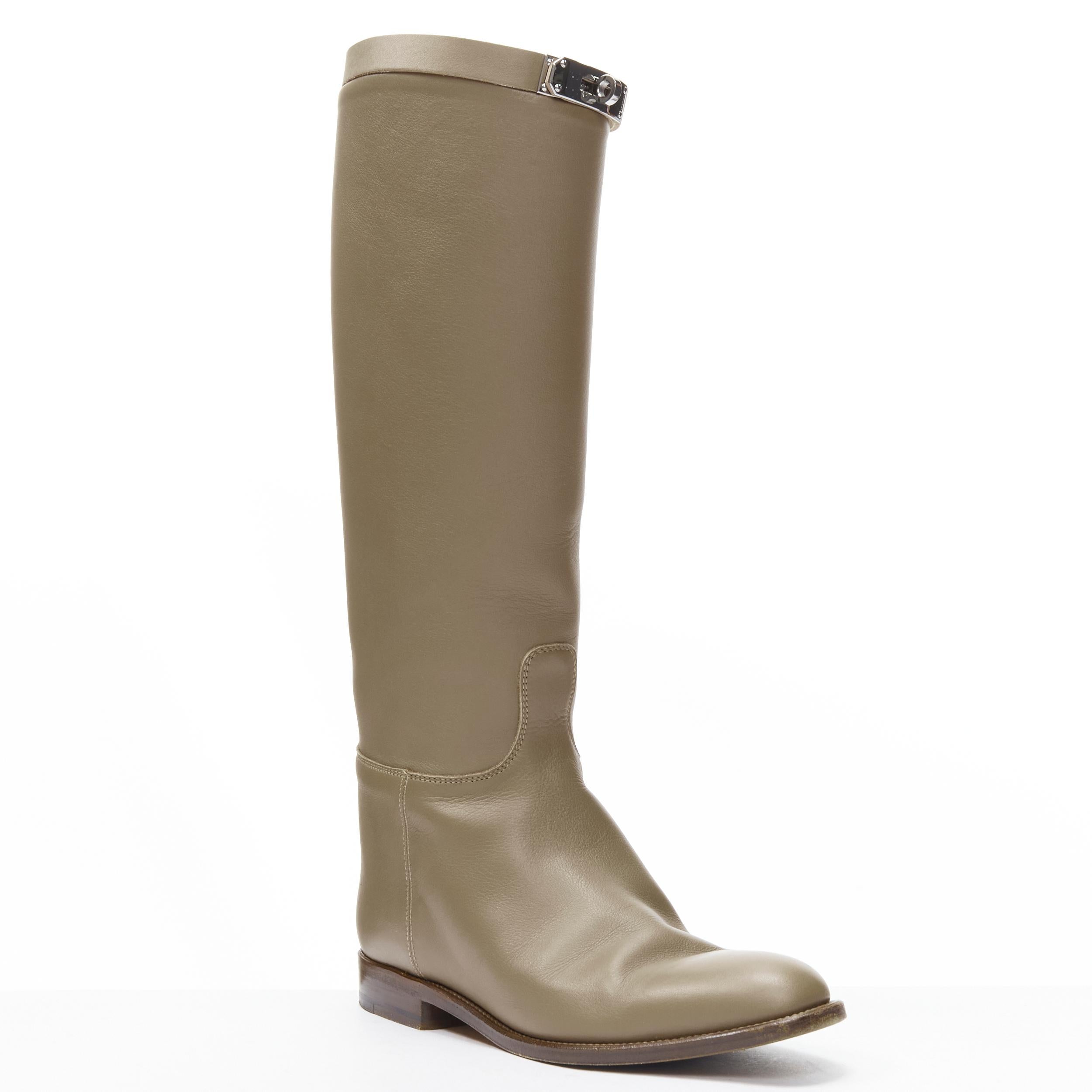 HERMES Kelly Jumping taupe brown PHW buckle riding boot EU37.5
Reference: MELK/A00229
Brand: Hermes 
Material: Leather 
Color: White 
Pattern: Solid 
Closure: Turnlock 
Extra Detail: Pull on boots. PHW Kelly turnlock strap. Concealed heel. Stacked