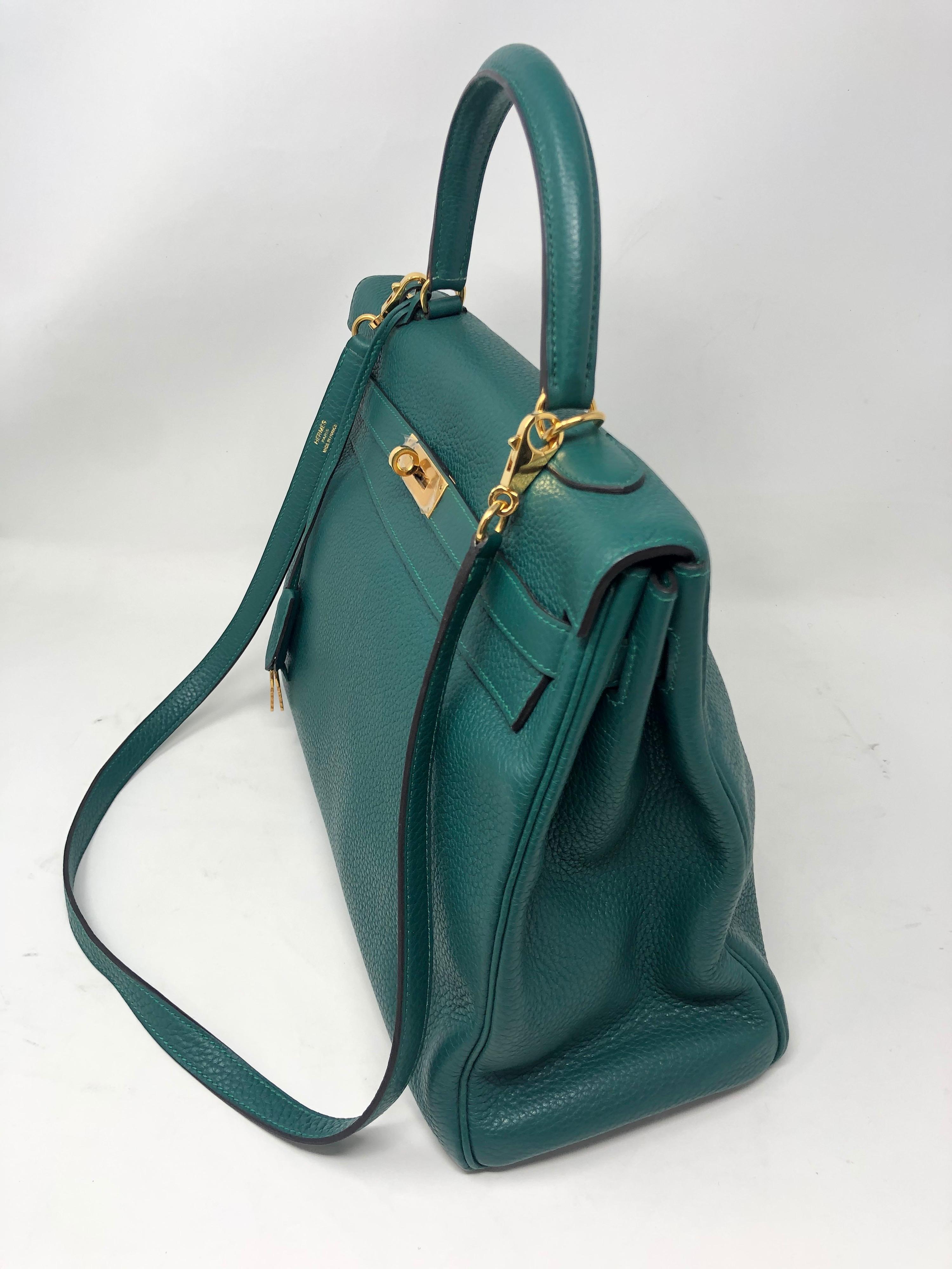 Hermes malachite green Kelly 35 bag with gold hardware. Excellent condition. Plastic still on hardware. Togo leather. B square. Includes lock, keys, clochette and Hermes dust cover. Guaranteed authentic. 