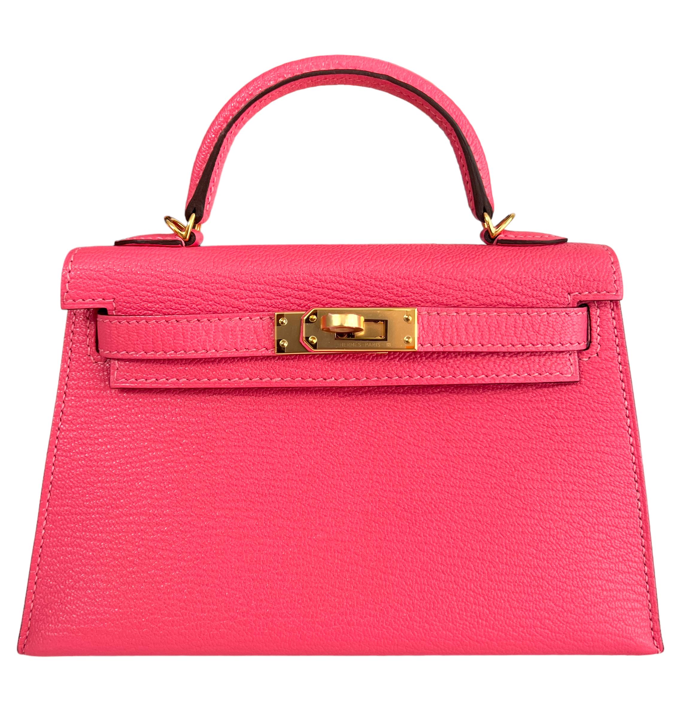 As New Ultra Rare and Hardest to get Hermes Mini Kelly 20 Rose Azalee Pink Chèvre Leather Complimented by Gold Hardware. Y Stamp 2020. 
Shop with Confidence from Lux Addicts. Authenticity Guaranteed! 

Lux Addicts is a Premier Luxury Dealer and one