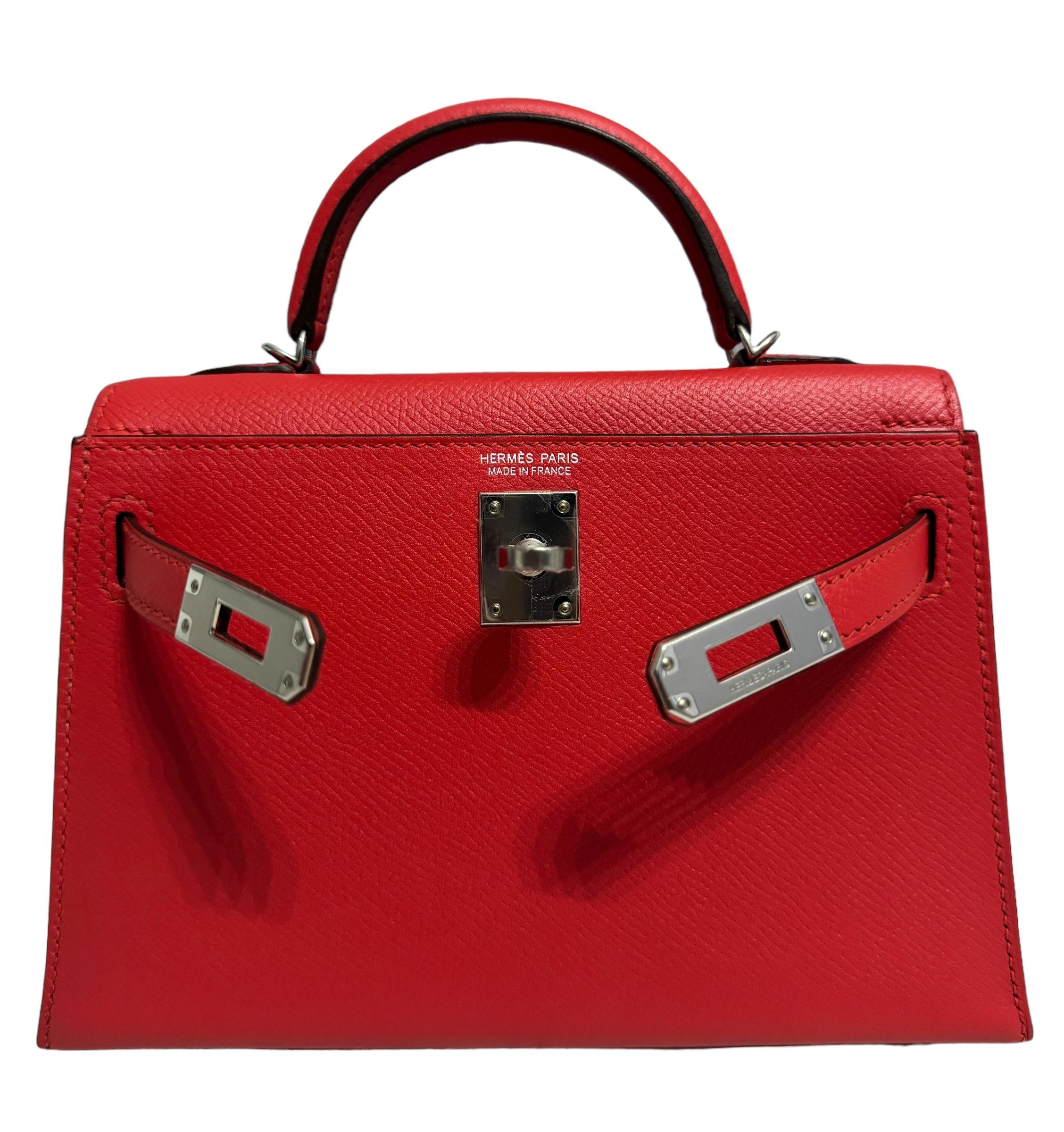 Ultra Rare and Hardest to get Hermes Mini Kelly 20 Rouge Tomate Epsom Leather Complimented by Palladium Hardware. Pristine Condition Plastic on all Hardware. Only Worn 2 Times. X Stamp 2016. From Collectors closet. 

Shop with Confidence from Lux