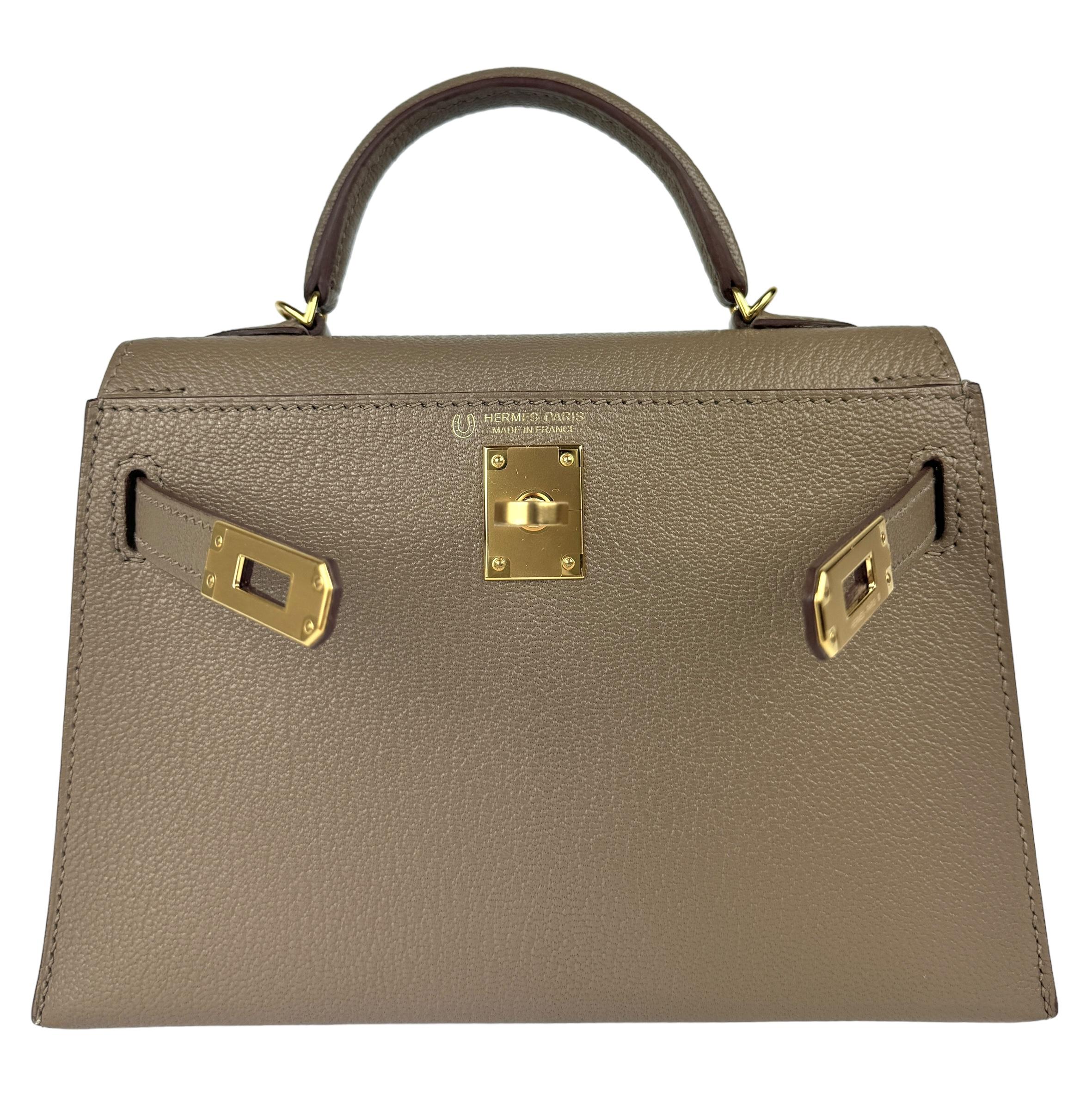 As New Ultra Rare and Hardest to get 1 of 1 Special Order Hermes Mini Kelly 20 Etoupe Chèvre Leather Complimented by Gris Interior and Gold Hardware. Z Stamp 2021. Includes all Accessories and Box.Minor Hairline Marks inside from strap being stored