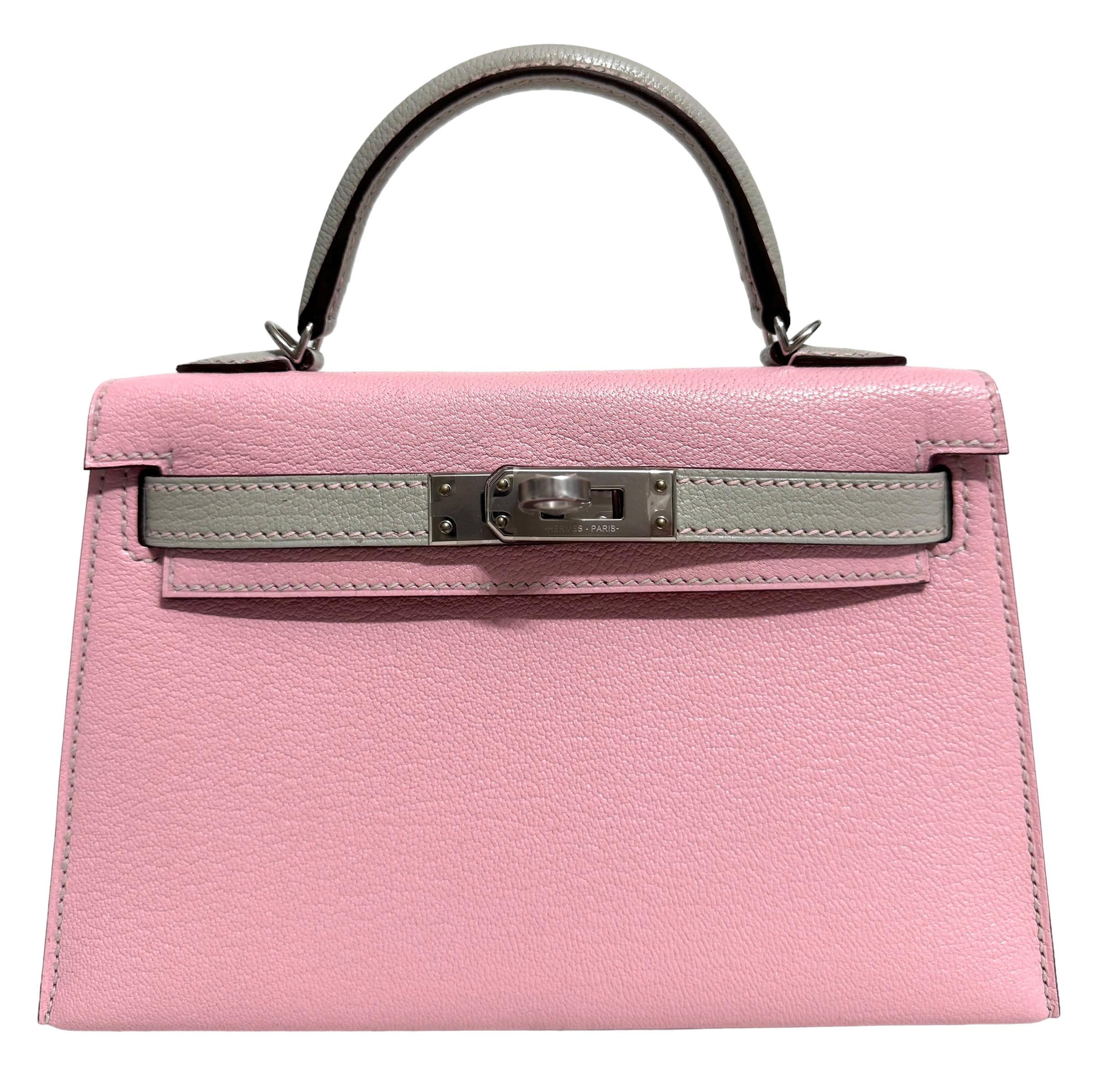 As New Ultra Rare and Hardest to get 1 of 1 Special Order Hermes Mini Kelly 20 Rose Sakura & Gris Perle Chèvre Leather Complimented by Palladium Hardware. U Stamp 2022. Includes all Accessories and Box.

Shop with Confidence from Lux Addicts.