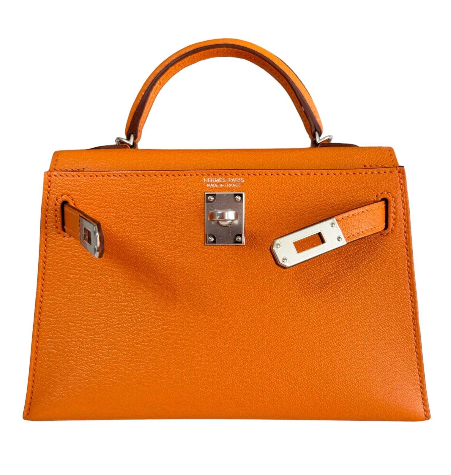 As New Ultra Rare and Hardest to get Hermes Mini Kelly 20 Verso Orange Chèvre Leather Sanguine Interior. Complimented by Palladium Hardware. Y Stamp 2020. Includes all Accessories and Box.

Shop with Confidence from Lux Addicts. We are a very well