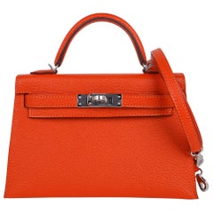 Sac Kelly Mini Sellier 20 bicolore en cuir de chèvre églantine orange, rose et gris Hermès 