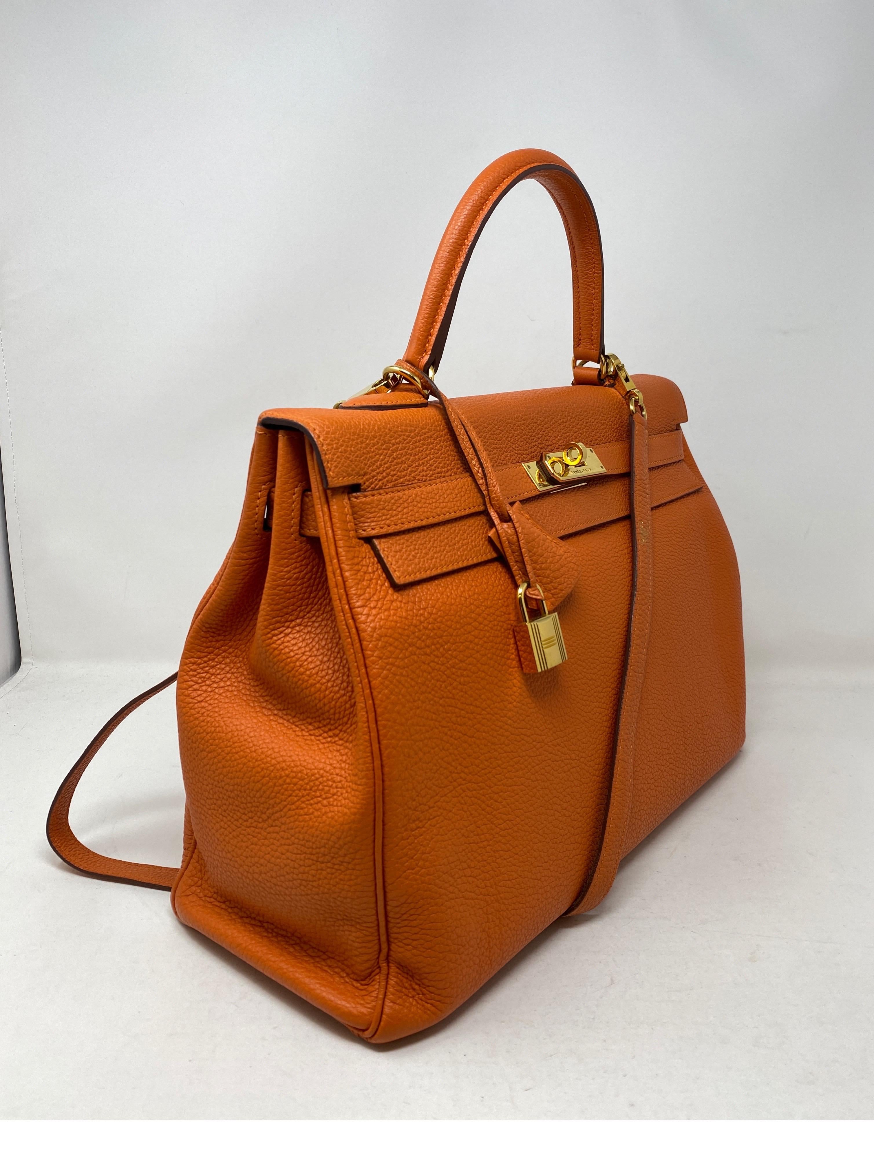 Hermes Orange Kelly 35 Bag. Gold hardware. Good condition. Kelly are desirable for their straps. Beautiful bag. Includes clochette, lock, keys, and dust cover. Guaranteed authentic. 