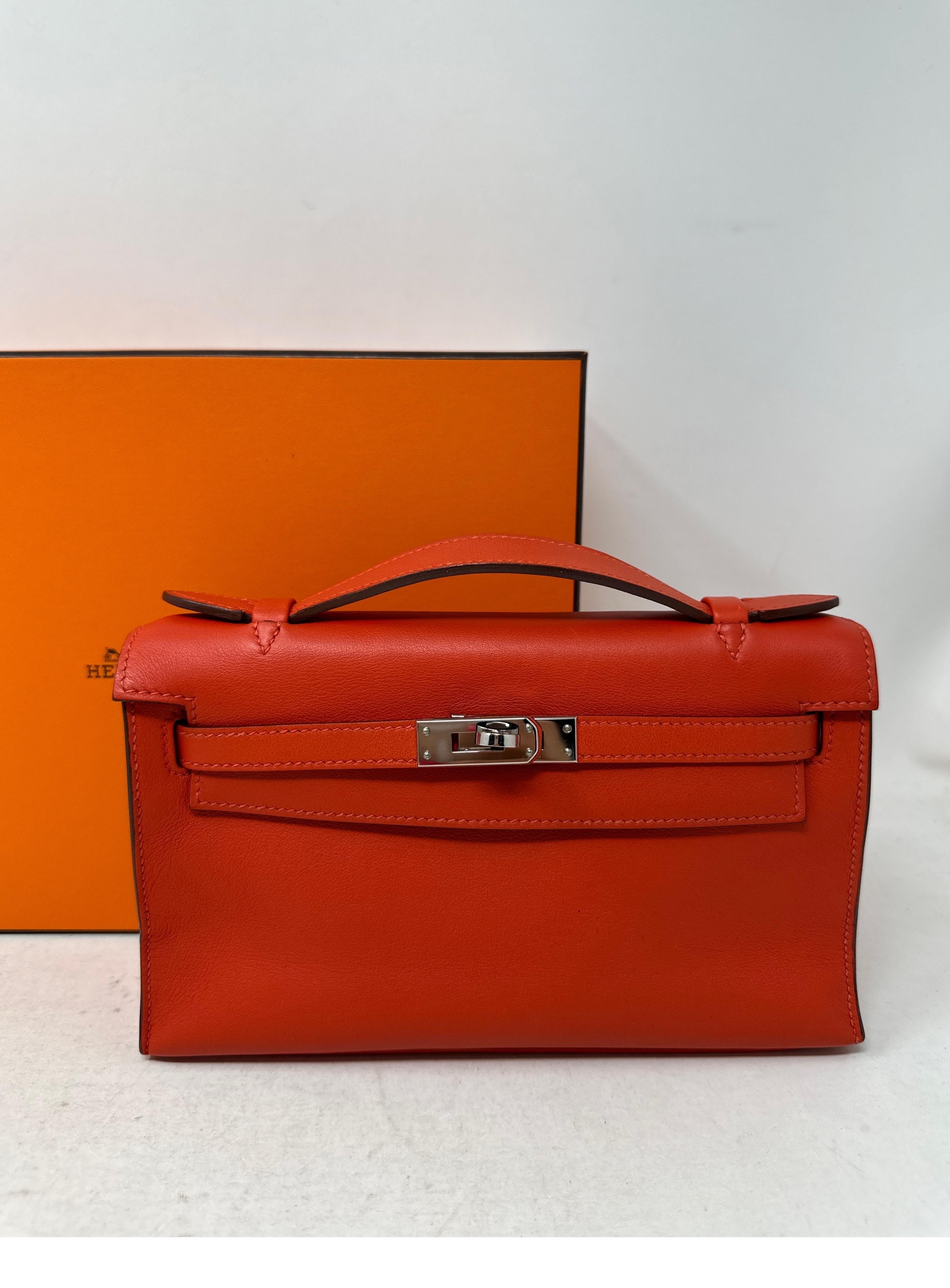 Women's or Men's Hermes Kelly Orange Pochette For Sale