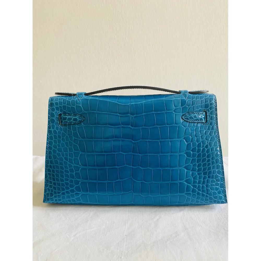 Blue Hermès Kelly pochette petrol blue silver hardware alligator 