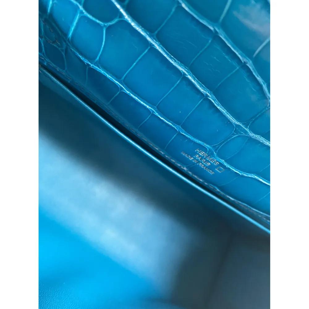 Women's or Men's Hermès Kelly pochette petrol blue silver hardware alligator 