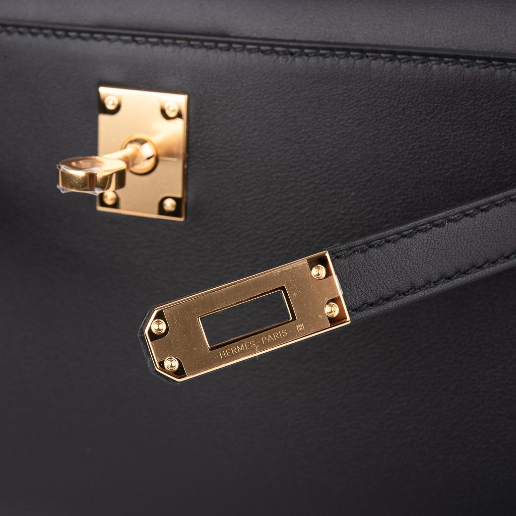 Guaranteed authentic Hermes Kelly pochette bag featured in sleek Black Swift leather.
This beautiful Hermes clutch is accentuated with gold hardware.
Signature stamp on interior.
Small interior compartment.
Comes with sleeper. 
NEW or NEVER