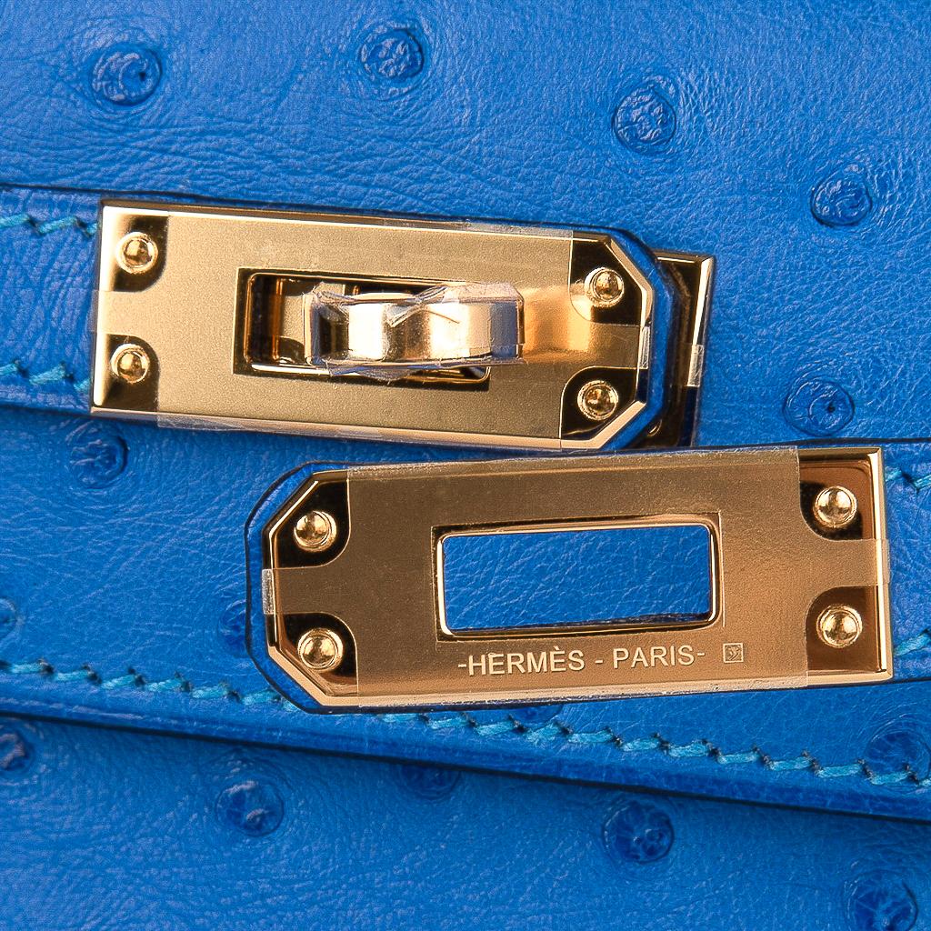 Guaranteed authentic Hermes Kelly Pochette bag features Bleuet Ostrich.
This beautiful vivid Hermes clutch is accentuated with gold hardware.
Signature stamp on interior.
Small interior compartment.
Comes with sleeper and signature Hermes box. 
NEW