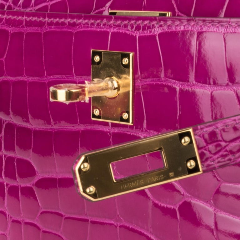 Mightychic offer a guaranteed authentic Hermes Kelly Pochette bag featured in vibrant Rose Scheherazade alligator.
This beautiful pink Hermes clutch is rich with Gold hardware.
Signature stamp on interior.
Small interior compartment.
Comes with