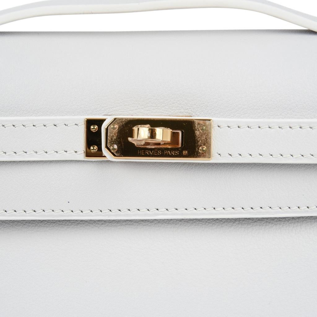 Guaranteed authentic rare Hermes Kelly Pochette clutch features white leather which is the most rare of all Hermes leather colours.
Sophisticated and chic accentuated with gold hardware.
Stamped HERMES MADE IN PARIS on the interior.
Small rear
