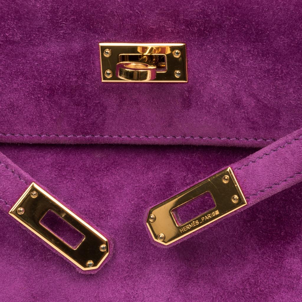Guaranteed authentic Hermes very rare crazy beautiful suede Violet purple Kelly pochette.
Rich with Gold hardware.
Signature stamp on interior.
Small interior compartment.
Clean corners and barely any markings on hardware.  
Very few small markings.
