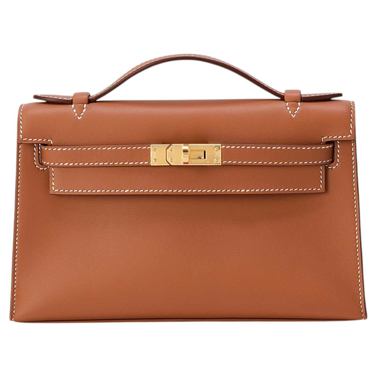 Hermes Kelly Pochette swift gold clutch — Hermès