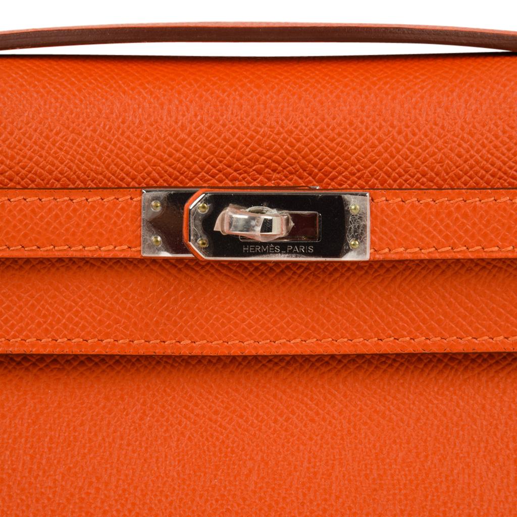 Guaranteed authentic Hermes Orange Feu Kelly  Pochette.
Fresh in epsom leather and palladium hardware.
Signature stamp on interior.
Small interior compartment.
Comes with sleeper and signature HERMES box. 
NEW or NEVER WORN. 
final sale

BAG