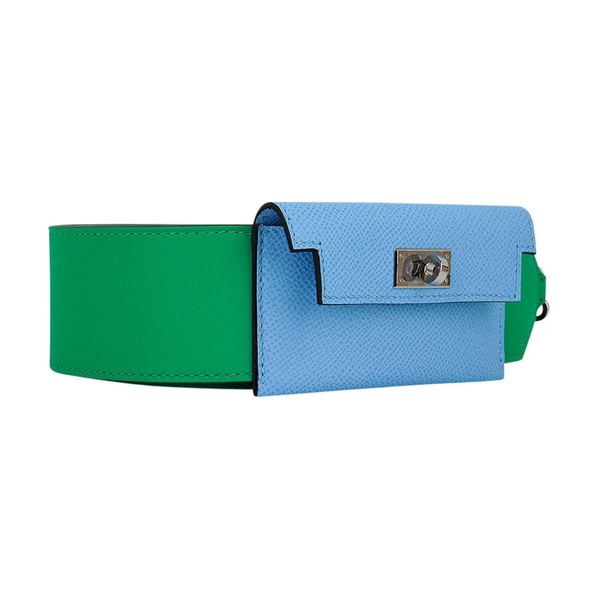 Mightychic offers an Hermes Kelly Pocket Bag Strap featured in Menthe and Blue Celeste.
The wide belt strap has a card holder with a Kelly turn key clasp.
Palladium hardware. 
The Menthe strap is Swift leather and the Blue Celeste card case is Epsom
