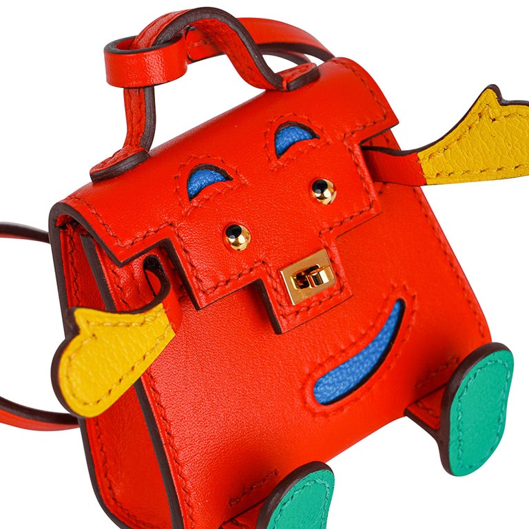 Mightychic offers a guaranteed authentic very rare limited edition Hermes Kelly Idole bag charm featured in  Capucine, Jaune de Naples, Vert Vertigo and Blue Zanzibar.
Bright and fun in Tadelakt leather.
Whimsical and delightful this fabulous charm