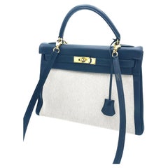 Borsa HERMÉS KELLY Retourne 32 cm in toile beige,  Pelle blu Courchevel 1995s