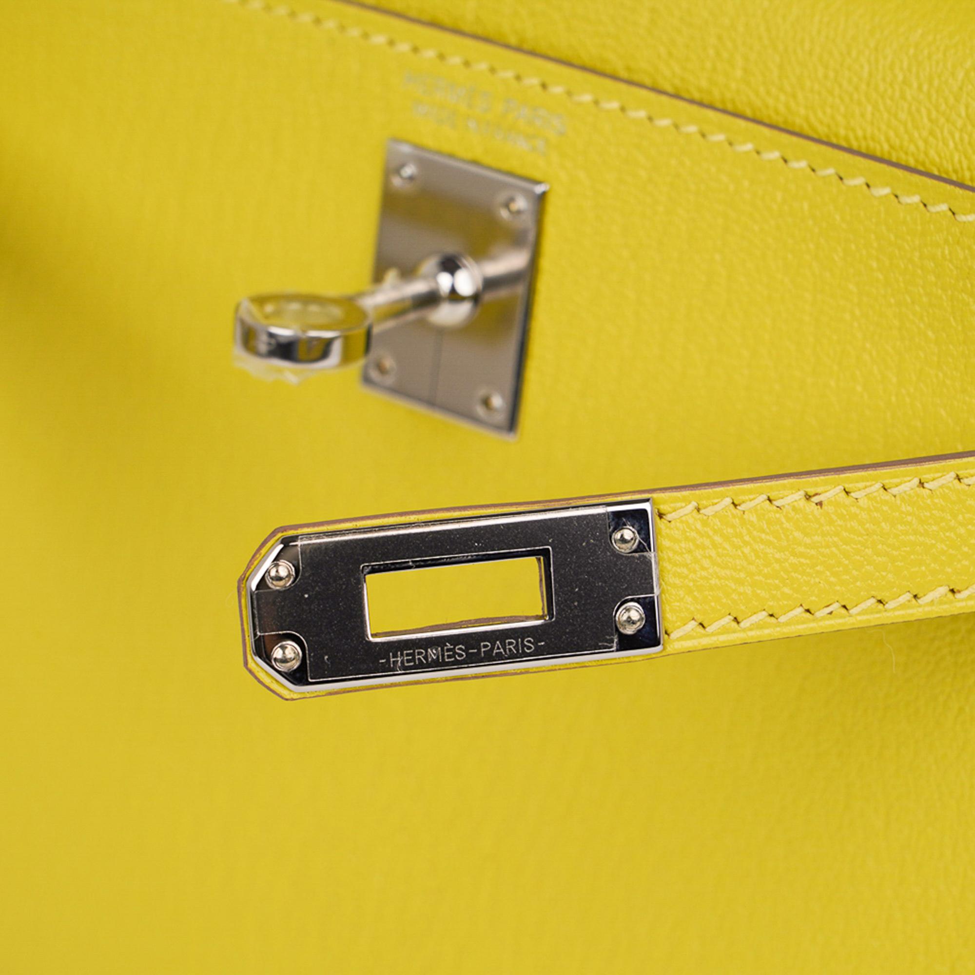 Guaranteed authentic Hermes Kelly 20 Mini Sellier bag featured in fresh Lime yellow. 
Chevre leather accentuated with Palladium hardware.
Comes with signature Hermes box, shoulder strap, and sleeper.
This bag is also available in Deep Blue, Rose