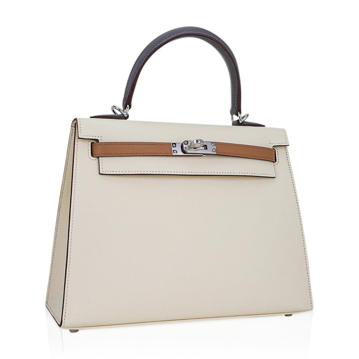 Mightychic offers an Hermes Kelly 25 bag featured in Nata, Chai and Gris Meyer.
A stunning combination of neutral hues to compliment a wide variety of your wardrobe.
The body is Nata with the straps in Chai and the top handle and clochette in Gris