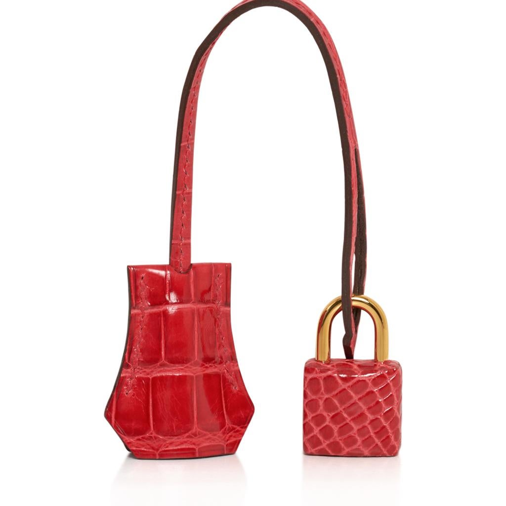 Guaranteed authentic exquisite Hermes Kelly 25 Sellier bag featured in Rouge de Coeur shiny Alligator. 
Rich with Gold hardware.   
Comes with signature Hermes box, raincoat, shoulder strap, sleepers, lock, keys and clochette.
NEW or NEVER
