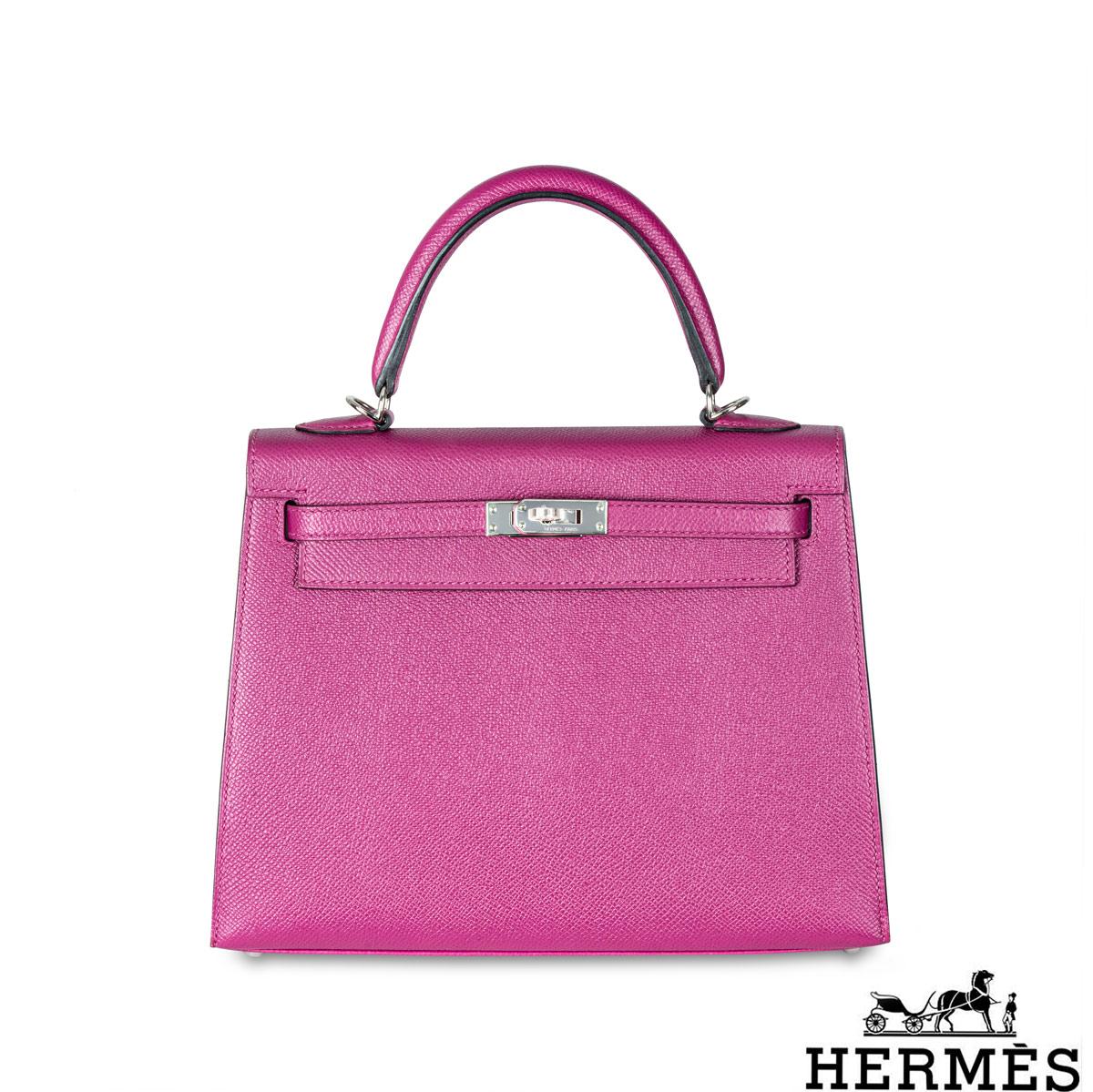 A spectacular Hermès 25cm Kelly bag. The exterior of this Kelly features a Sellier style in Rose Pourpre leather. The Rose Pourpre leather is complemented with palladium hardware and tonal stitchings. It features a front toggle closure with two