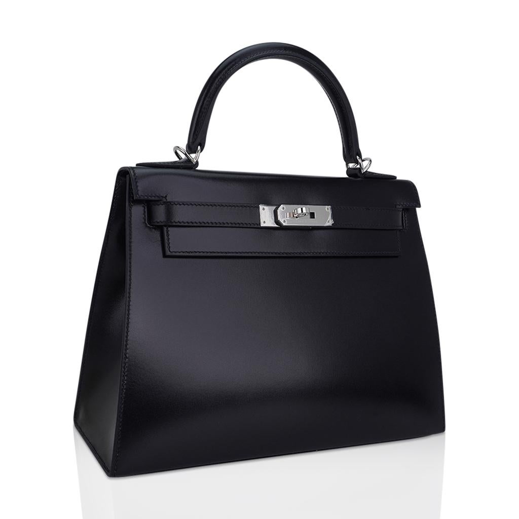Mightychic offers an  Hermes Kelly Sellier 28 bag featured in rare Black Box leather.
Considered to be of the most collectible hertiage leathers from Hermes, this timeless beauty exudes chic style.
Fresh with Palladium Hardware.
Divine size for day