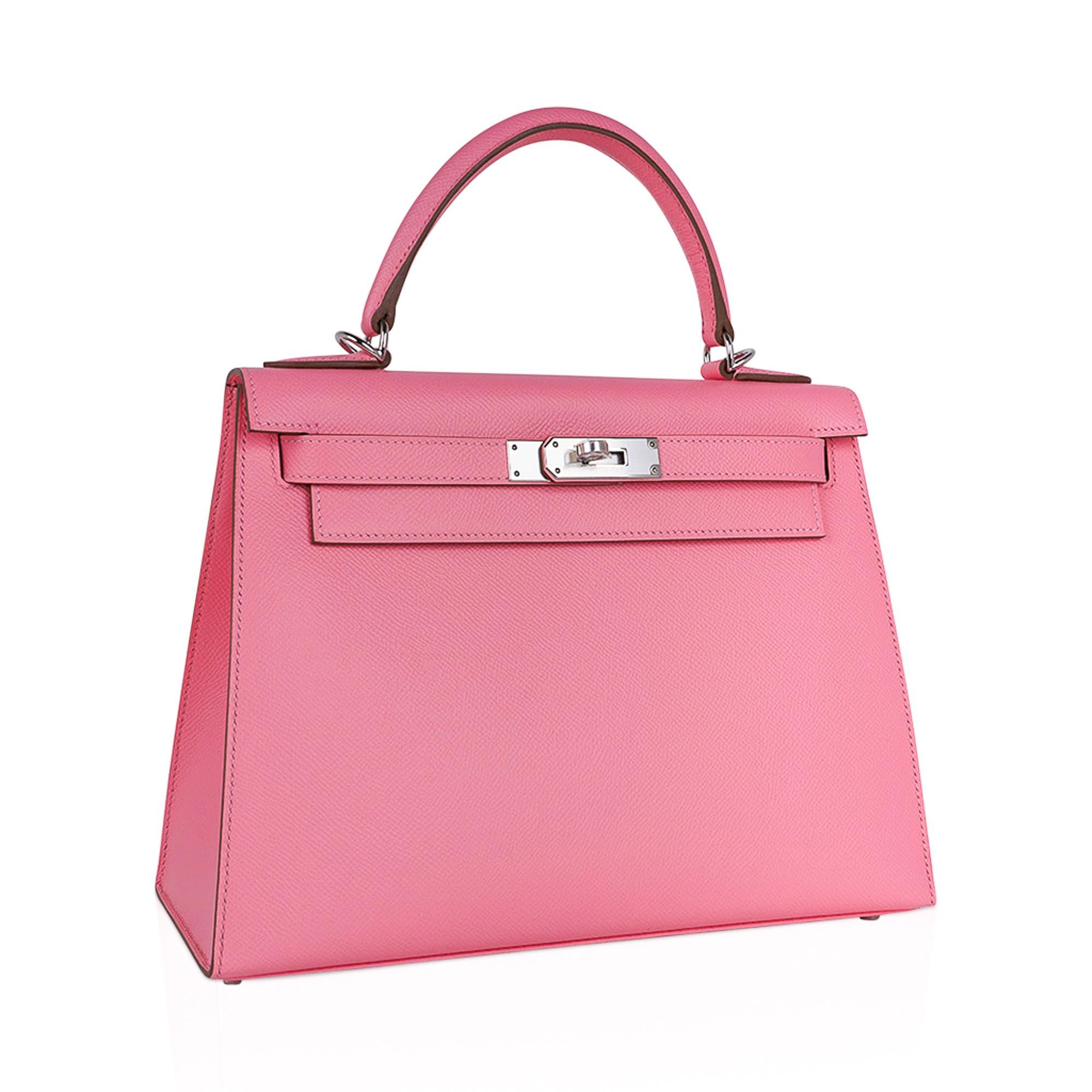 Mightychic offers an Hermes Kelly Sellier 28 bag featured in pink Rose Confetti.
This iconic Hermes Kelly Sellier bag is timeless and chic.
Epsom leather is frequently used for saturated colours as it elevates the best hues.
Fresh with palladium