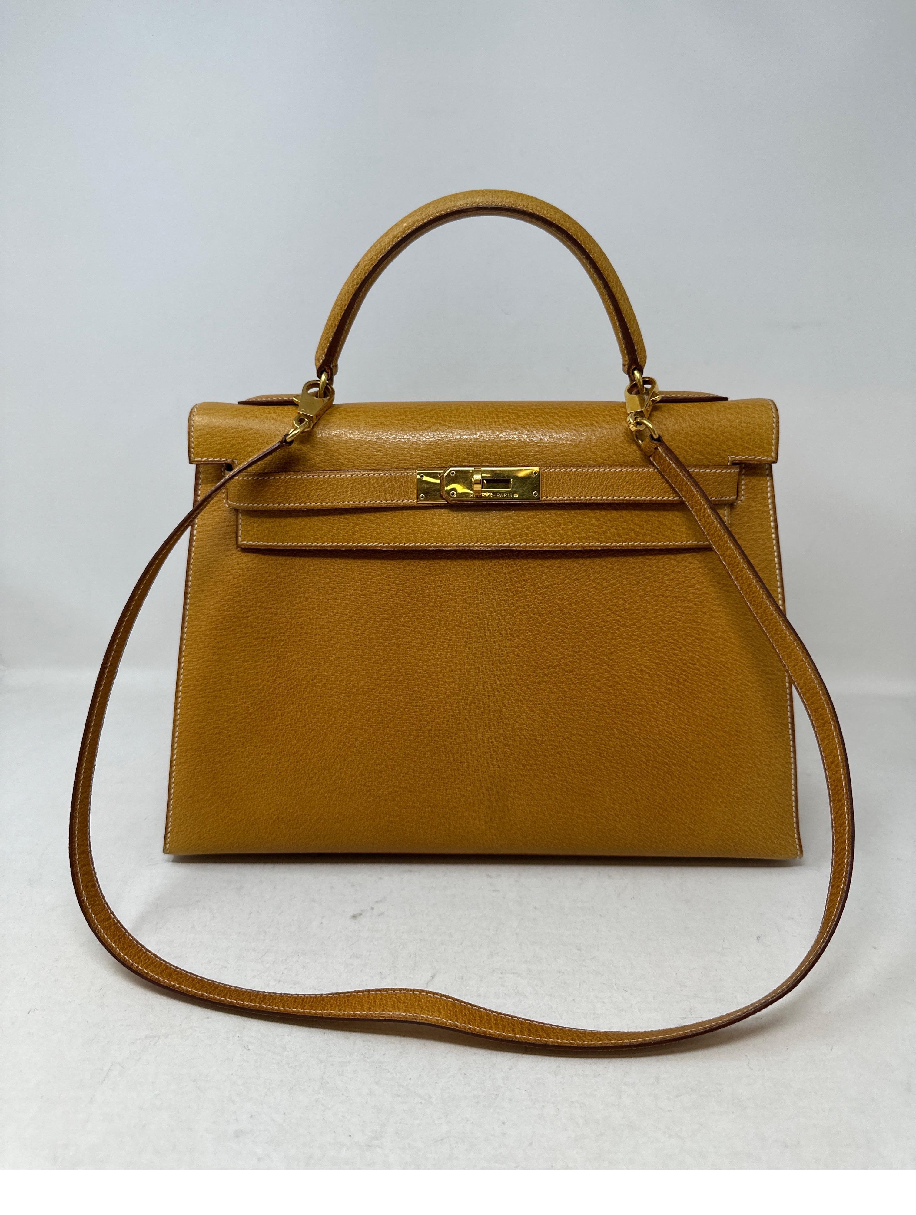 Hermes Sellier Kelly 32 Bag. Good vintage condition. Interior clean. Natural tan color chevre leather. It is a vintage Kelly. The clochette, lock, keys, and dust bag are included. Please note the clochette leather part that holds the keys is torn.