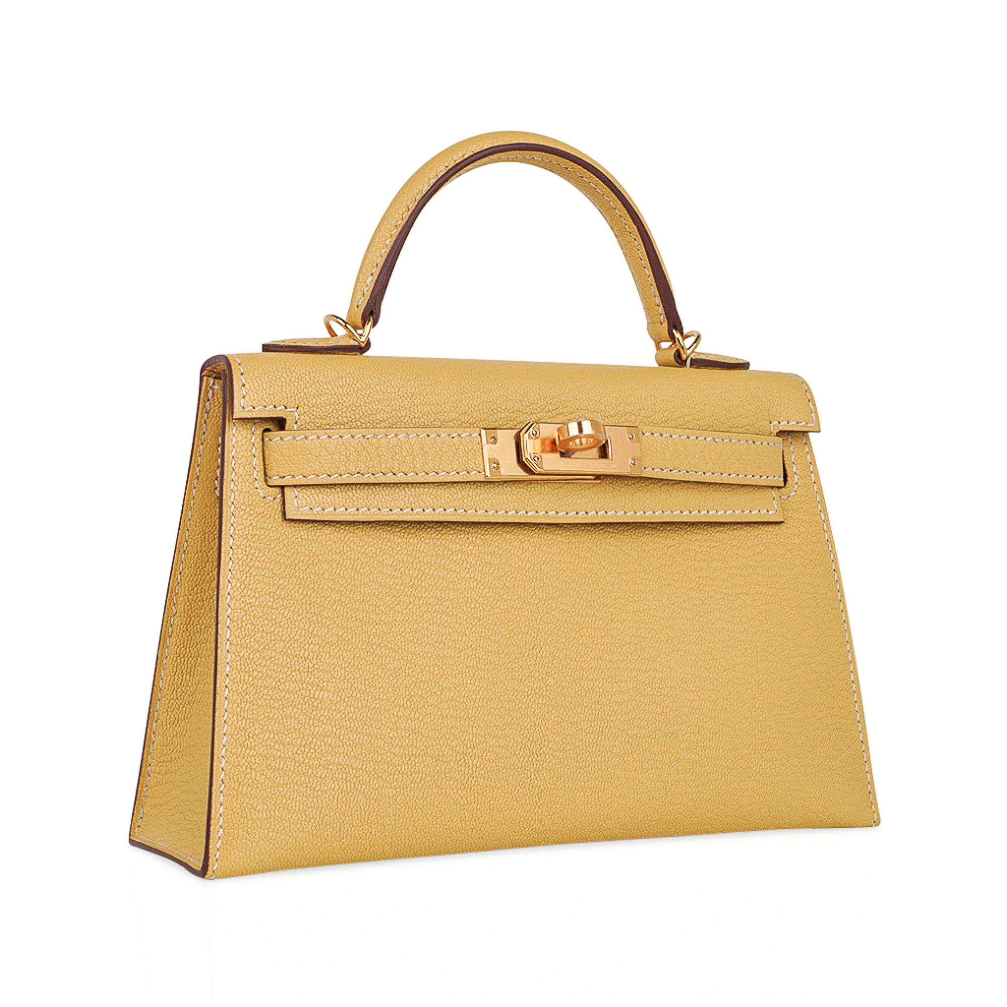 Mightychic offers an Hermes Kelly 20 Mini Sellier bag featured in rare Jaune Foin (Hay) yellow.  
Chevre leather accentuated with Gold hardware.
Comes with signature Hermes box, shoulder strap, and sleeper.
Please see our Kelly 20 Collection for an