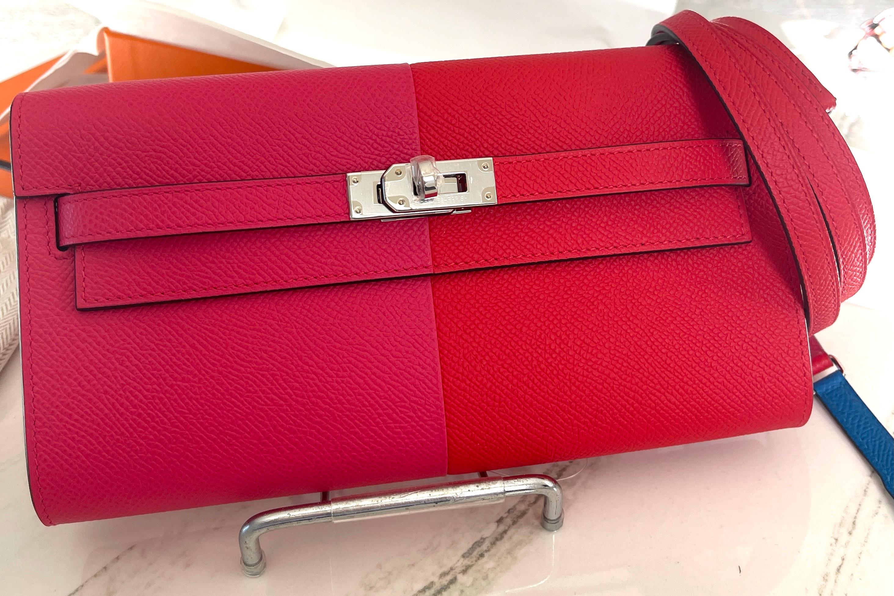 Hermes
Kelly to Go
Tri Color
Such a versatile little Bag

Color is Rose Extreme Rouge Casaque and lined in blue


Tonal topstich 
Epsom Leather
Palladium Hardware

Removable strap
 To attach it to the wallet interior, you slide the strap through the