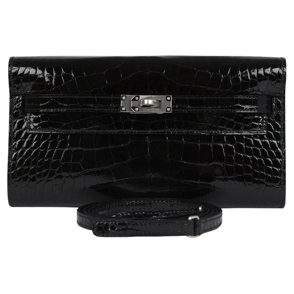 Hermes Kelly To Go is in Black Shiny Alligator with palladium hardware For Sale