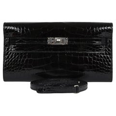 Hermes Kelly To Go is in Black Shiny Alligator with palladium hardware