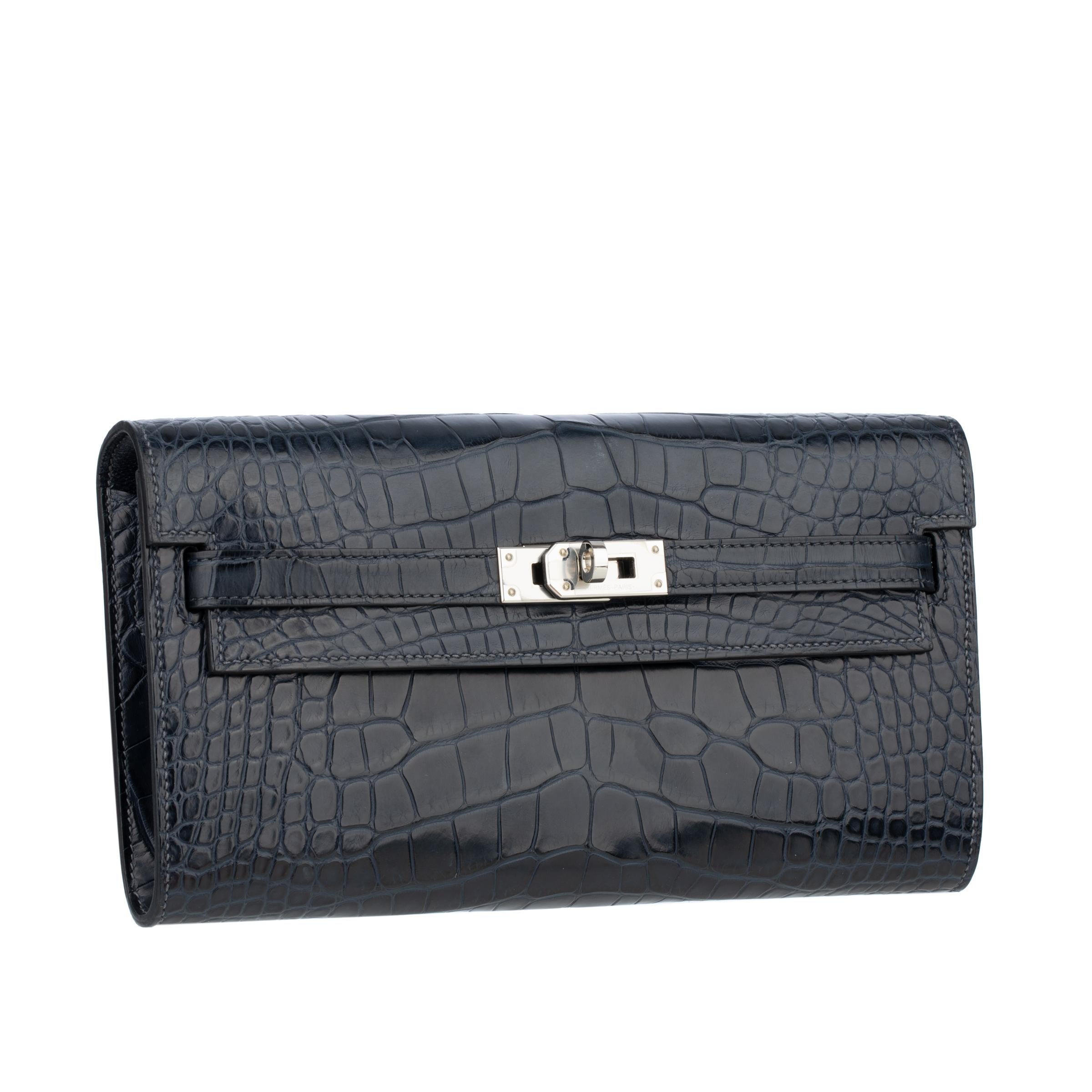 Brand; Hermès

Product: Kelly-To-Go Wallet

Dimensions:
CM: 19.7 l x 11.5 h x 1.5 d
INCH: 7.8