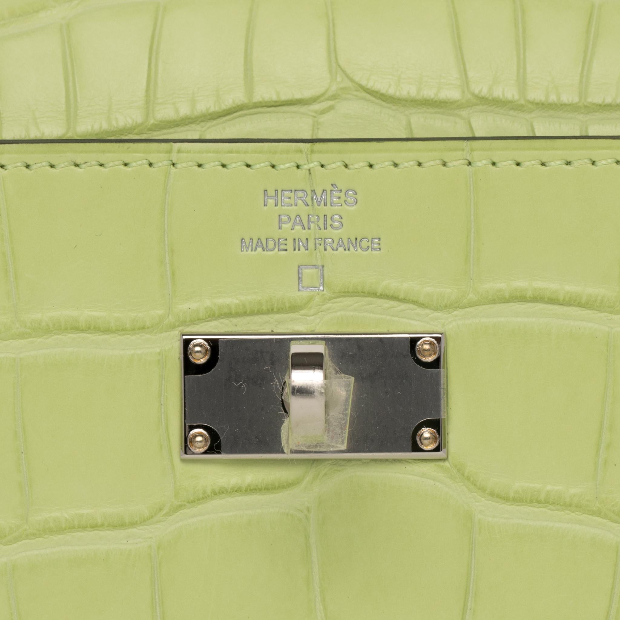 Brand: Hermès 
Style: Kelly To Go Wallet 
Size: 19.7 L x 11.5 H x 1.5 D cm
Color: Jaune Bourgeon
Leather: Matte Alligator
Hardware: Palladium
Stamp: 2020 Y
Other: Removable shoulder strap, 4 credit card slots, zipped change purse and palladium