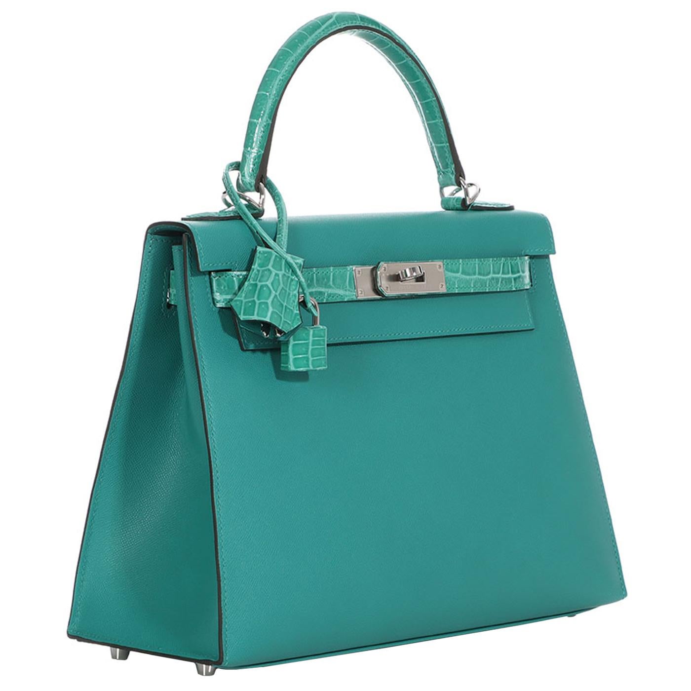 This Kelly, in the Sellier style, is in Vert Verone madame leather and Crocodile Sellier with palladium hardware, front flap, two straps with center toggle closure, clochette with lock and two keys, single rolled top handle, and removable shoulder