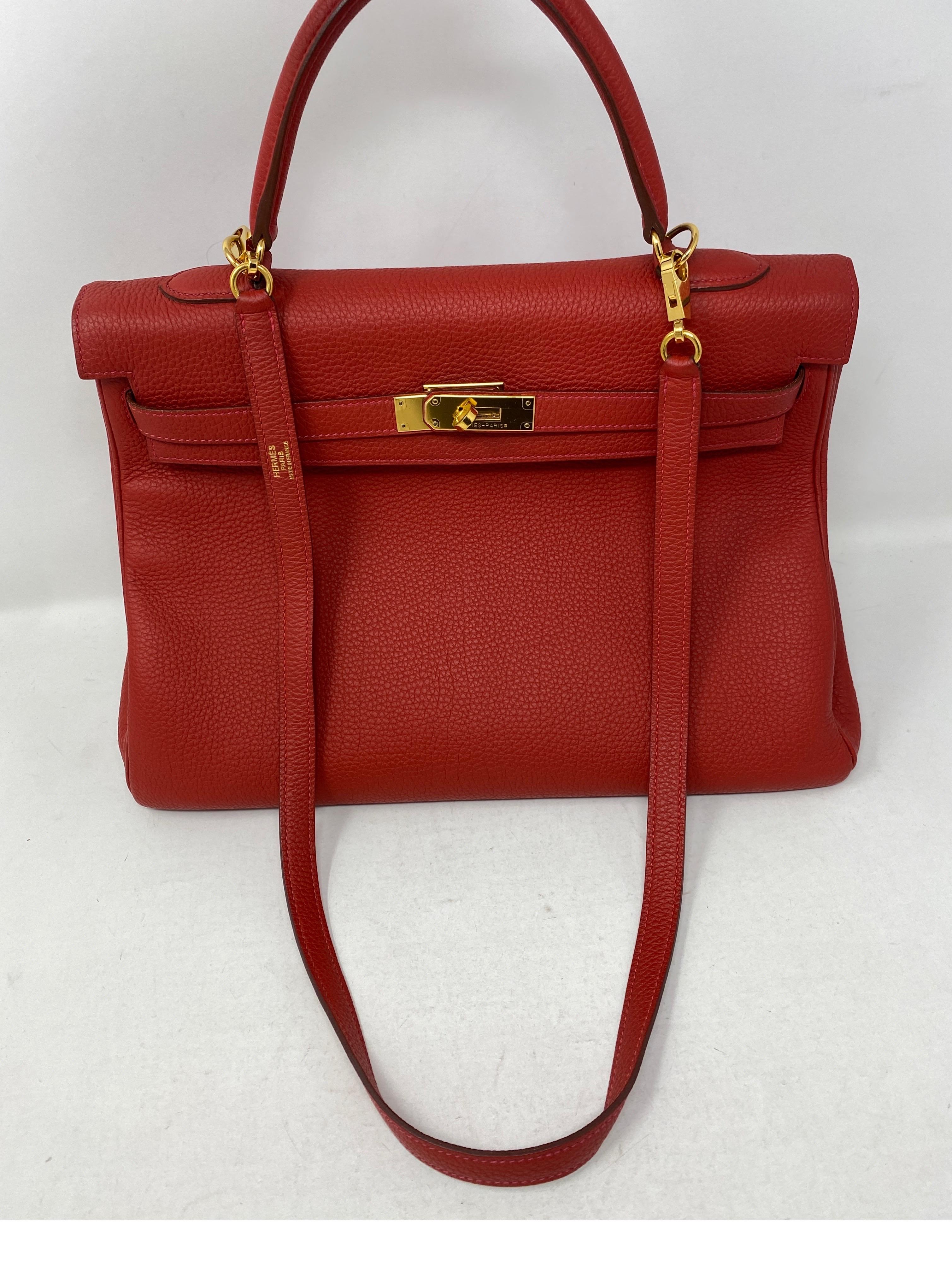 Hermes Vermillion Red Kelly 35 Bag. Beautiful red with orange undertones color with gold hardware. Togo leather. Good condition. Comes with original receipt. Guaranteed authentic. 