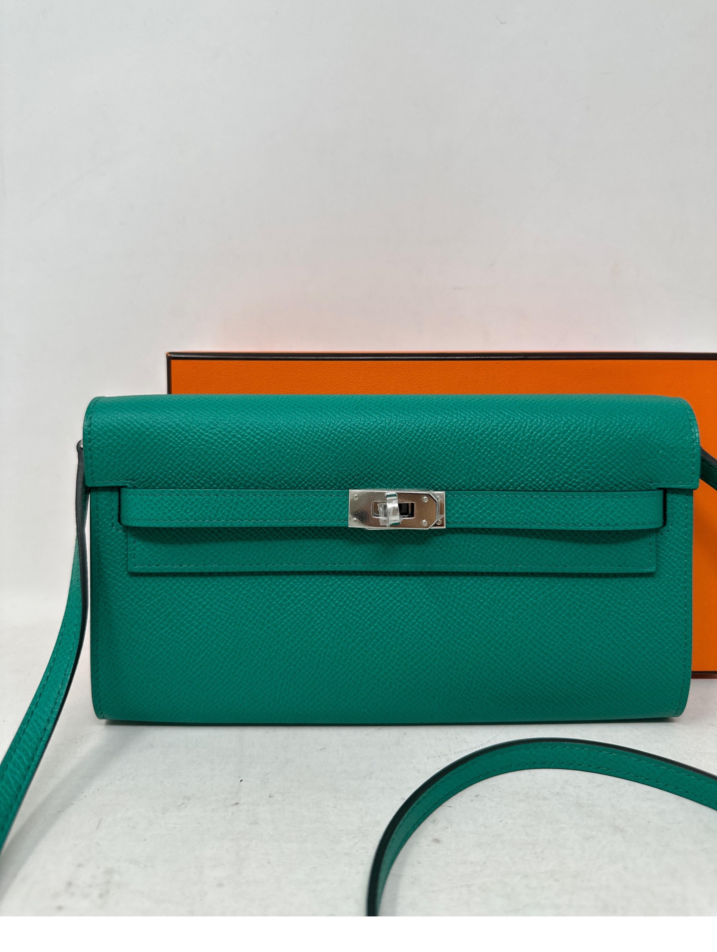 Hermes Kelly Wallet To Go Vert Green Crossbody bag. New from 2023. Vert jade color with palladium hardware. Plastic still on hardware. Full set with box. Great gift item. Brand new condition. Can be worn as a clutch or as a crossbody bag. Guaranteed
